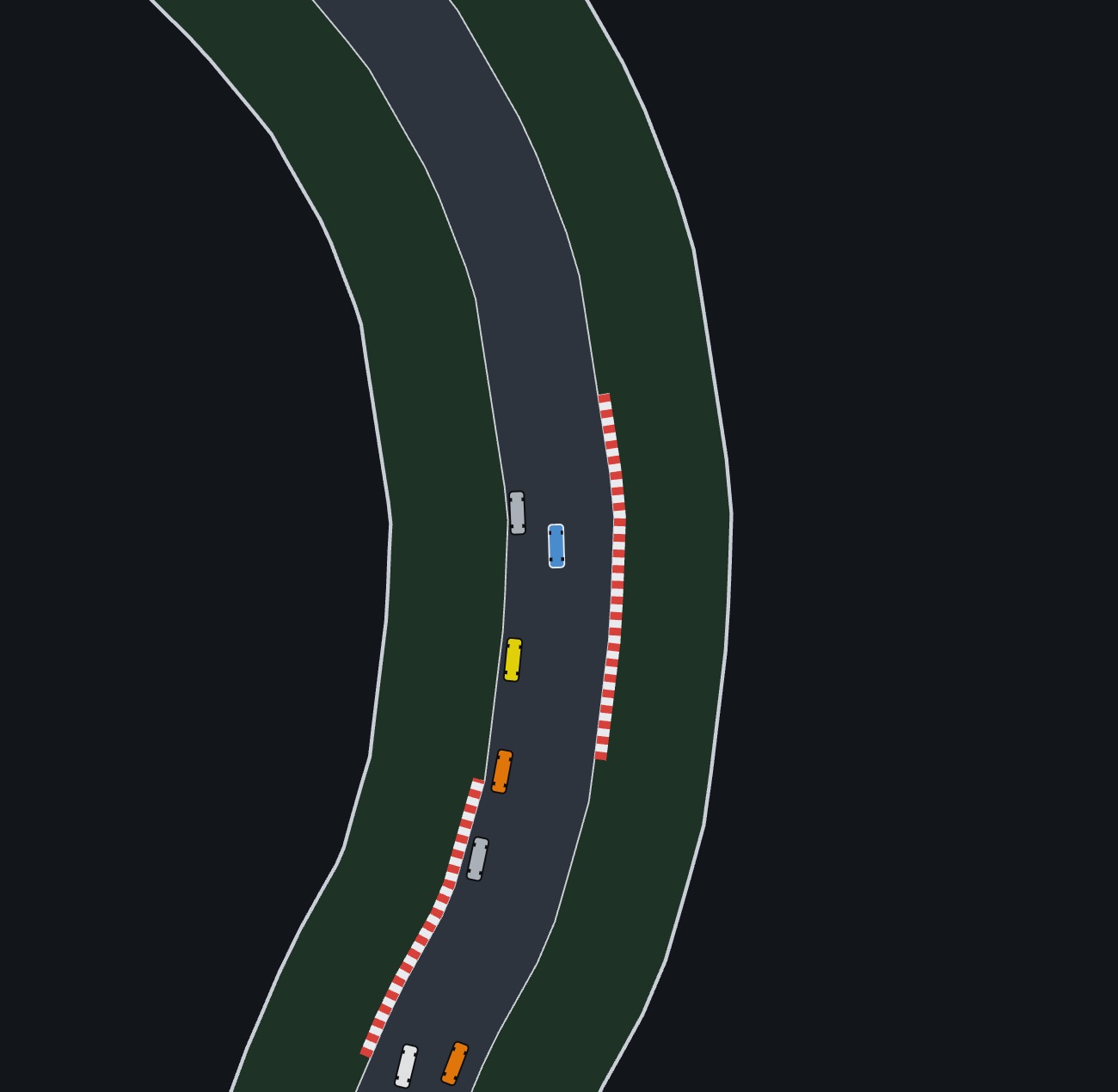 A close view: lap one, the cars go through a corner in a line. The kerbs, grass and barriers come from the track's markup