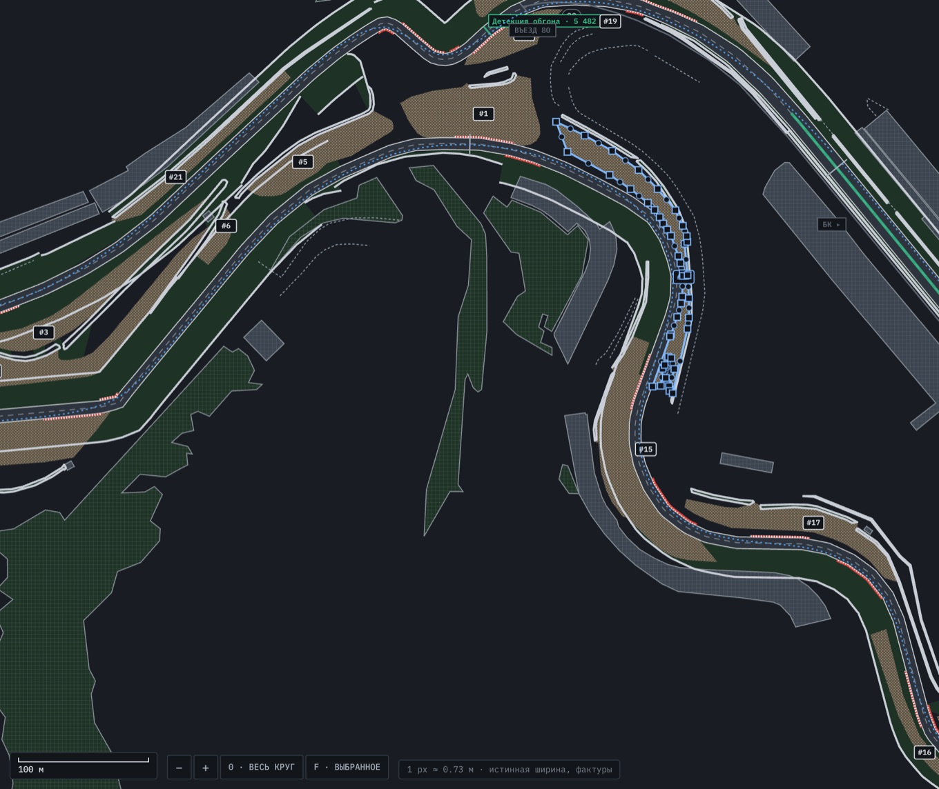 The track editor: gravel, grass, barriers, buildings and kerbs. From this markup the physics knows what is under a wheel past the edge and where the barrier is. One gravel zone is selected. Zones and buildings are from OpenStreetMap data (© OpenStreetMap contributors, ODbL)